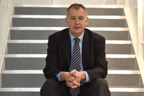 John sitting on a flight of stairs