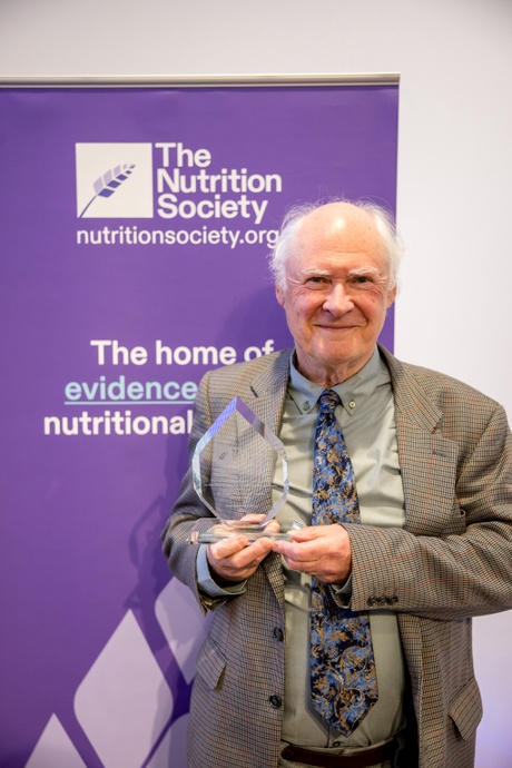 Prof Harry Flint holding the Gowland Hopkins Award at the Nutrition Society Winter Conference 2026 (photo by Richard Murgatroyd Photography)