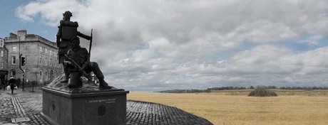 Statue with field in background
