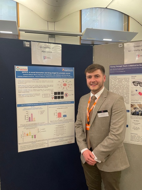 Student Cameron Whyte stood beside his research poster