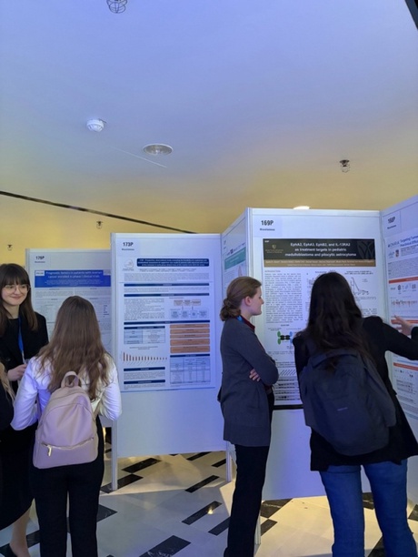 People stood reading research posters at the conference
