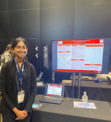 Student Sivaranjani stood beside her research poster