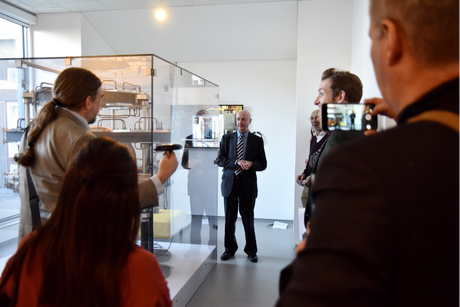 Prof Lurie discusses the history of MRI developments in Aberdeen next to the Mk1 MRI scanner, currently on display in the NHS Grampian hospital
