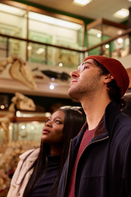 A male and female university student examine specimens in the Zoology Museum