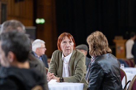 People speaking at a table