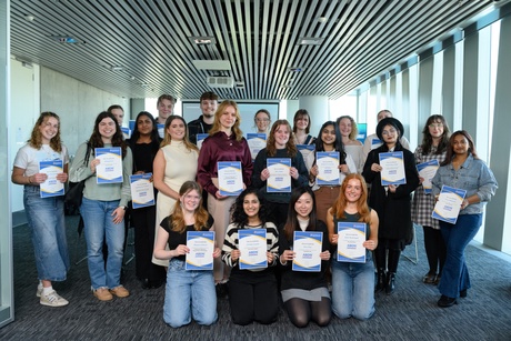 Students smiling with their certificates