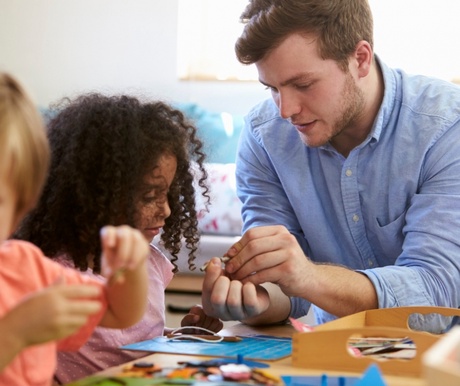 Early Years practitioner helping a young learner