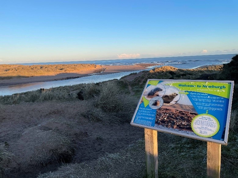 Newburgh Beach with tourist signboard