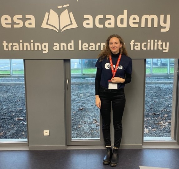 Sara stood in front of ESA Academy sign