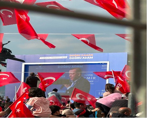 Flags and audience at Erdogan rally.