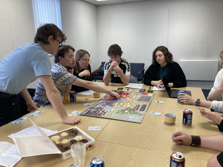 Students playing "Twilight Struggle" at the Aberdeen Security Studies Wargaming Club