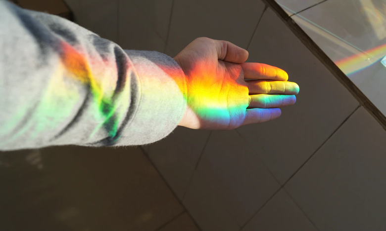 photo of a hand with a rainbow