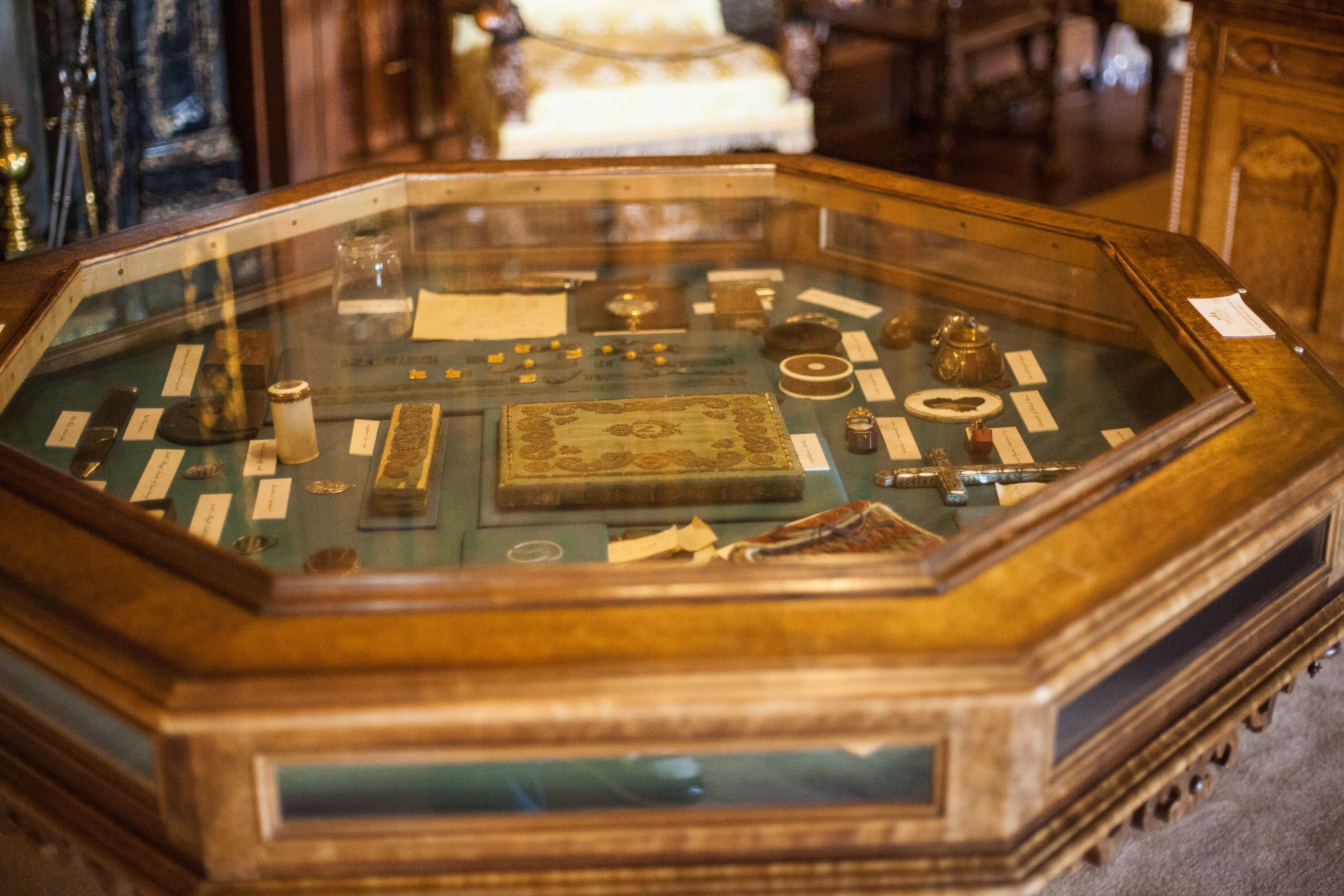 Scott’s cabinet of curiosities. A table-shaped display cabinet filled with small, indistinct objects.