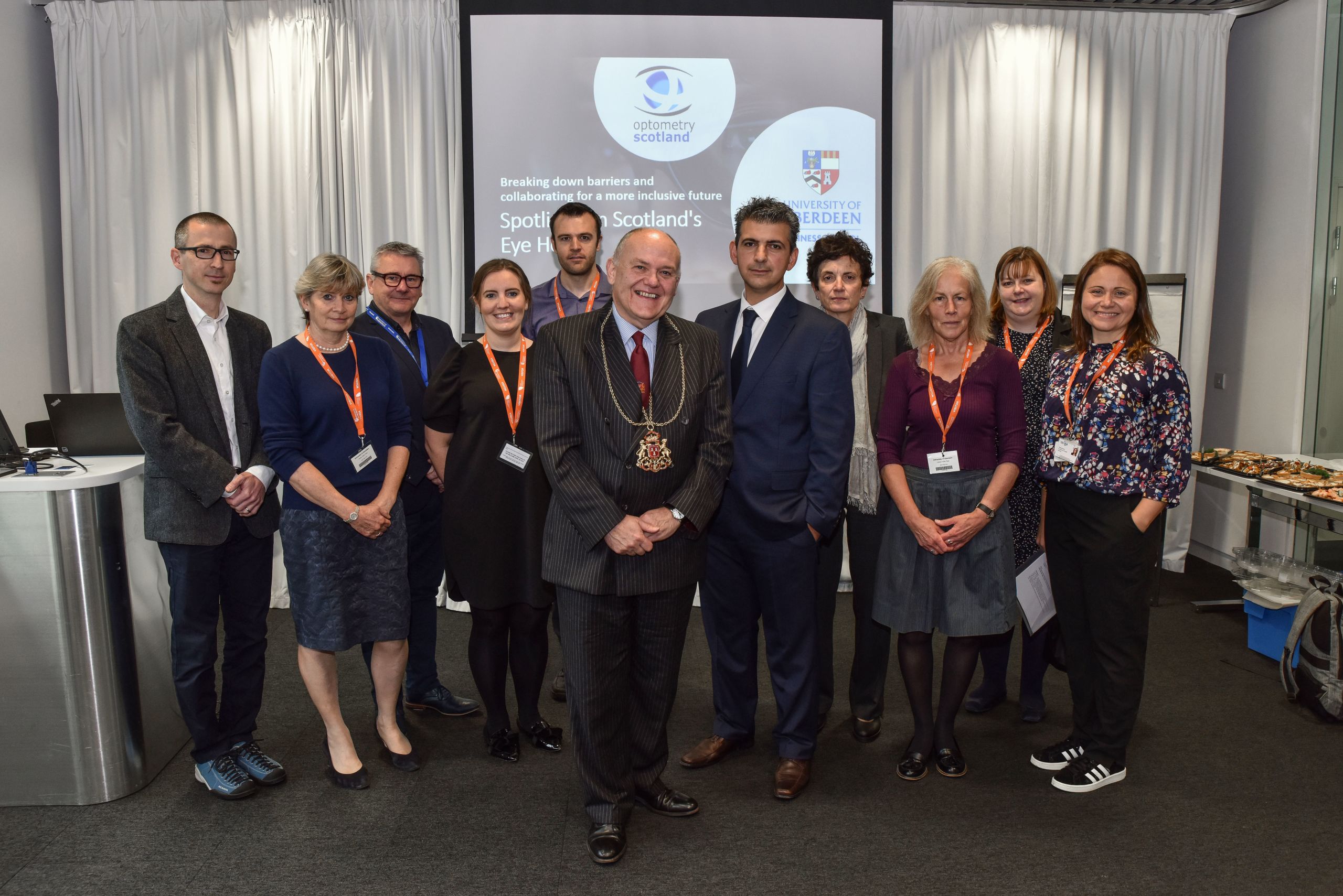 Lord Provost of Aberdeen standing with the event attendees