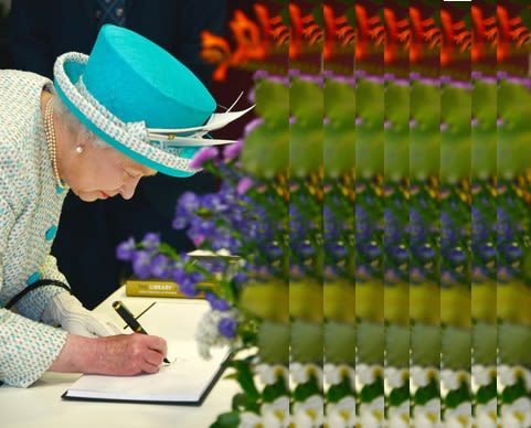 The Queen signing the official visitor's book in 2012