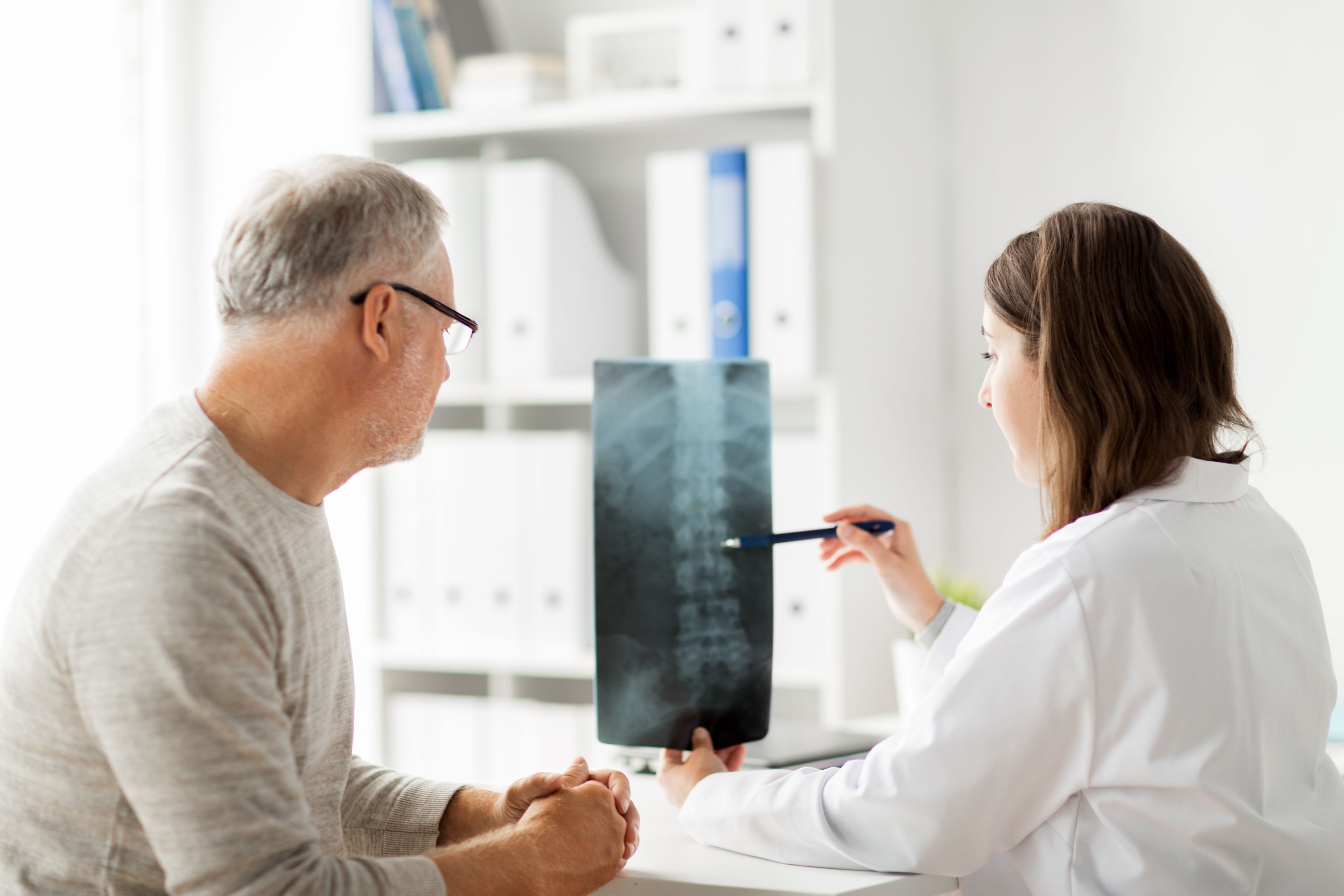 Doctor looking at spinal X-Ray