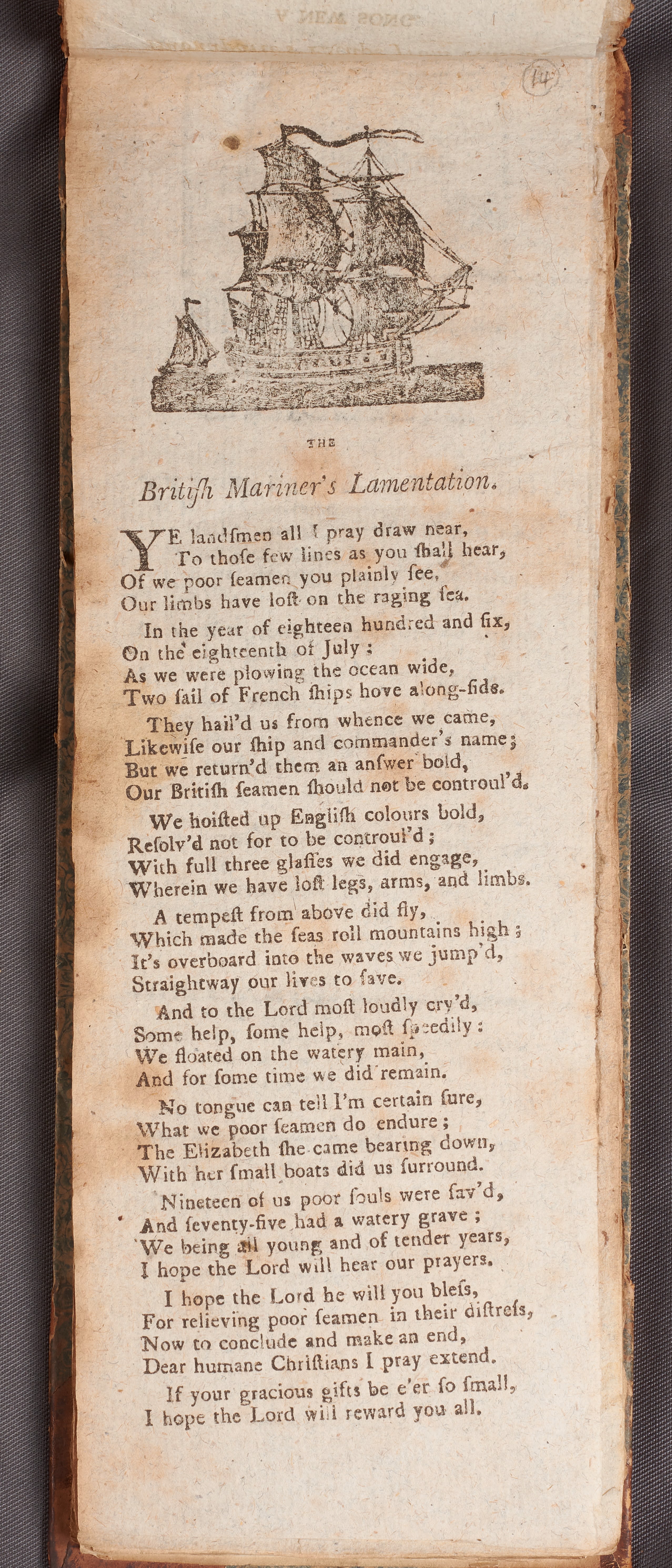 A printed page on which there is a picture of a ship and a poem called ‘The British Mariner’s Lamentation.’