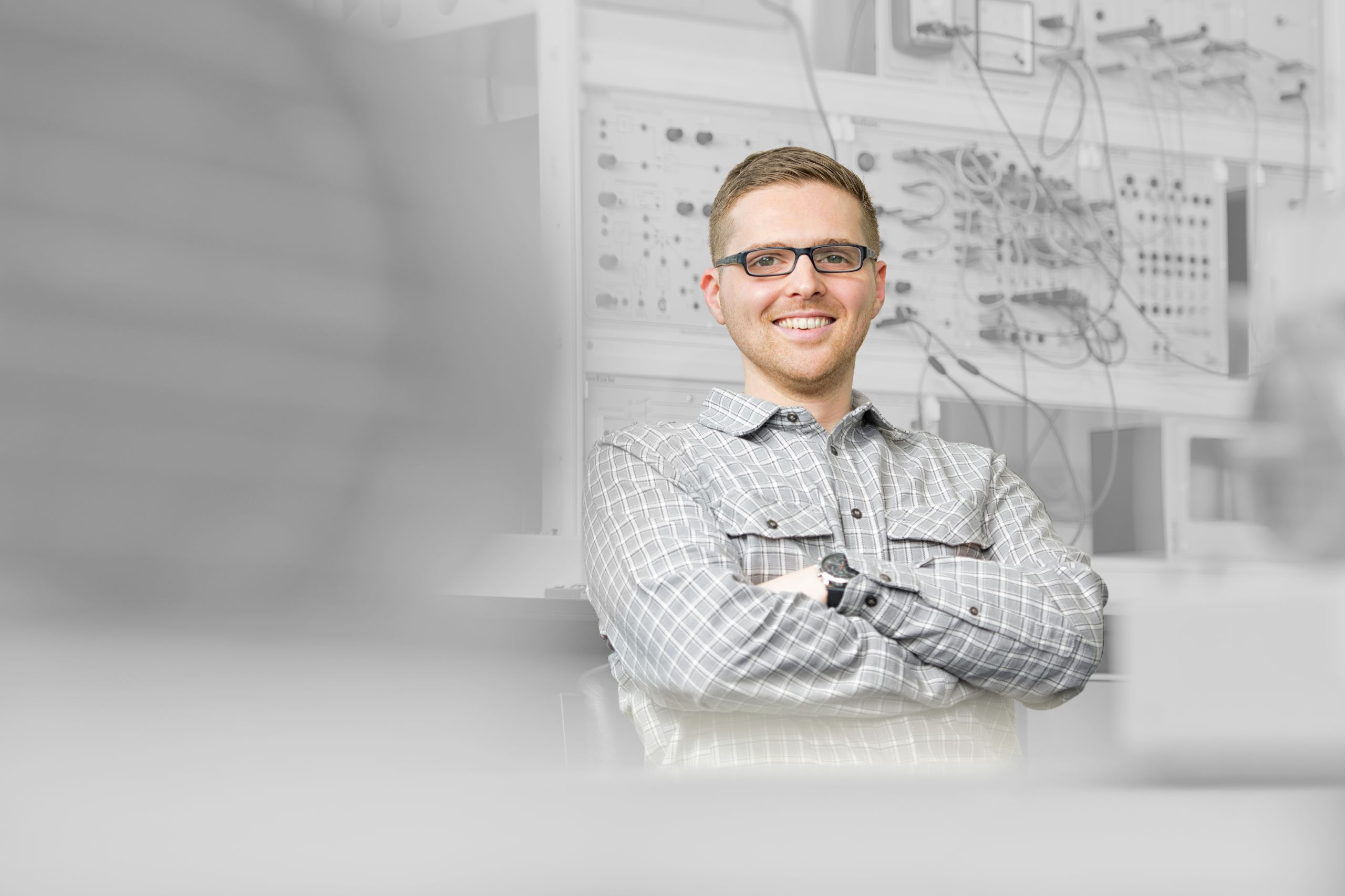 Photo of James Short on a black and white background.