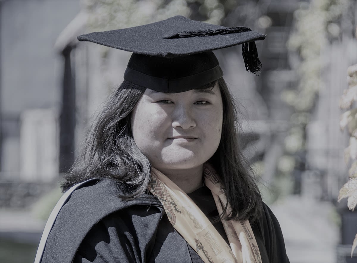 Maya Sherpa with her graduate cap on a sunny day at University of Aberdeen.
