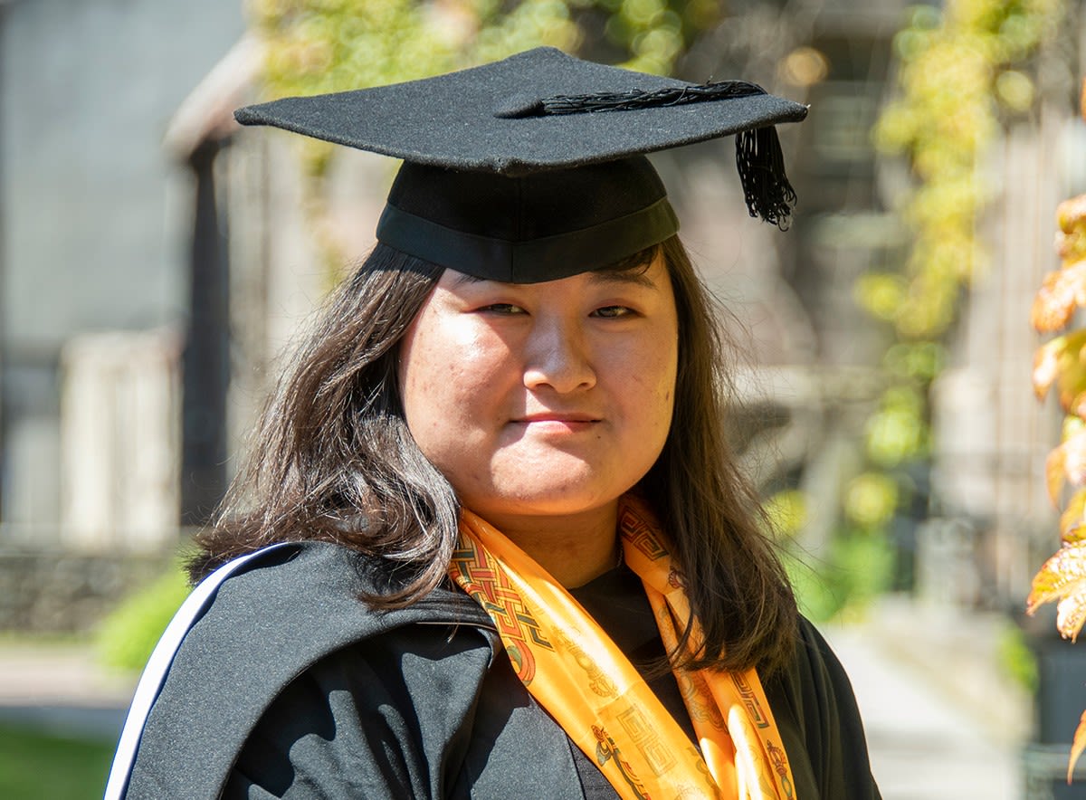 Maya Sherpa with her graduate cap on a sunny day at University of Aberdeen.