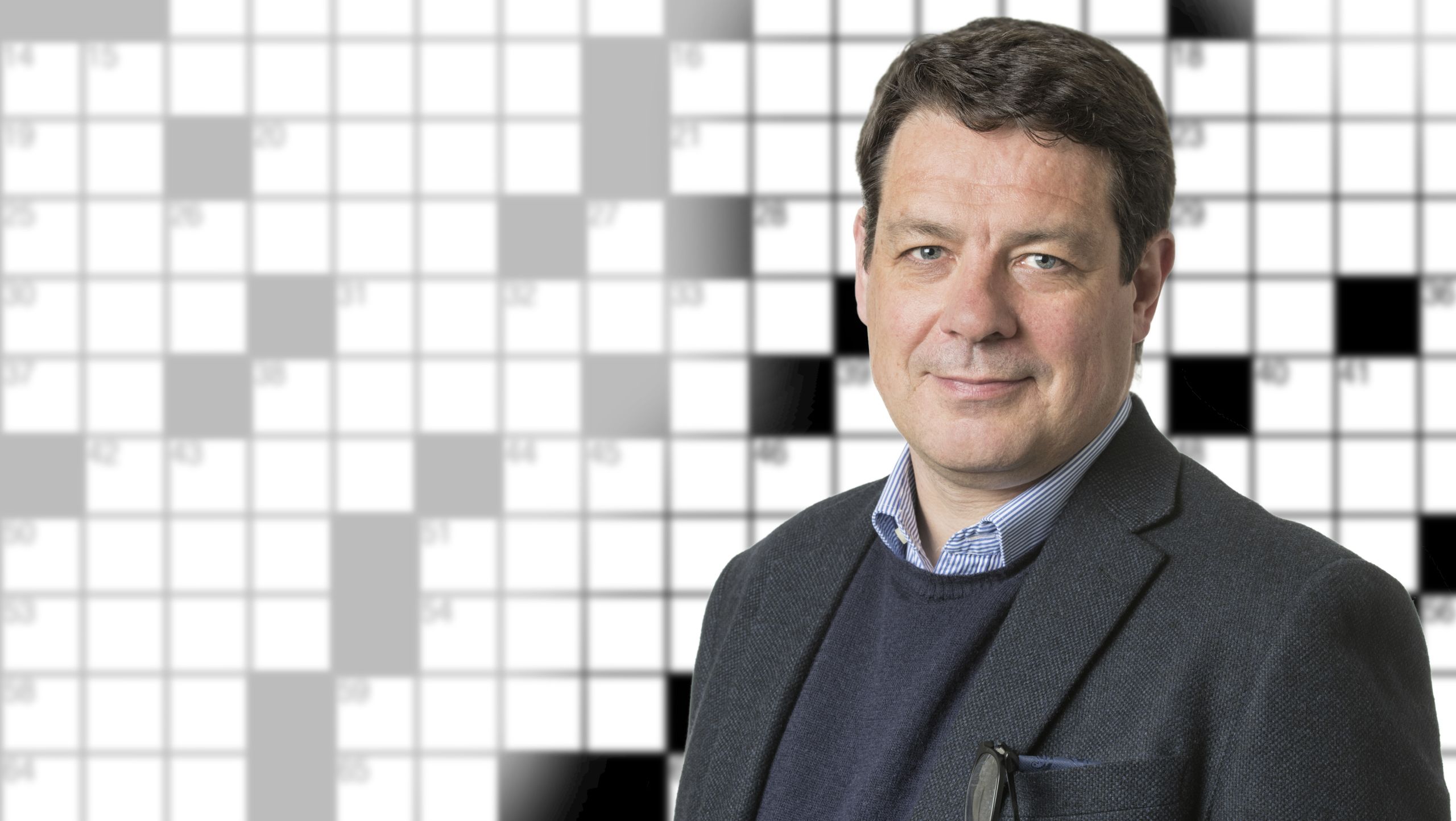 Photo of Roger Staff with a crossword in the background.