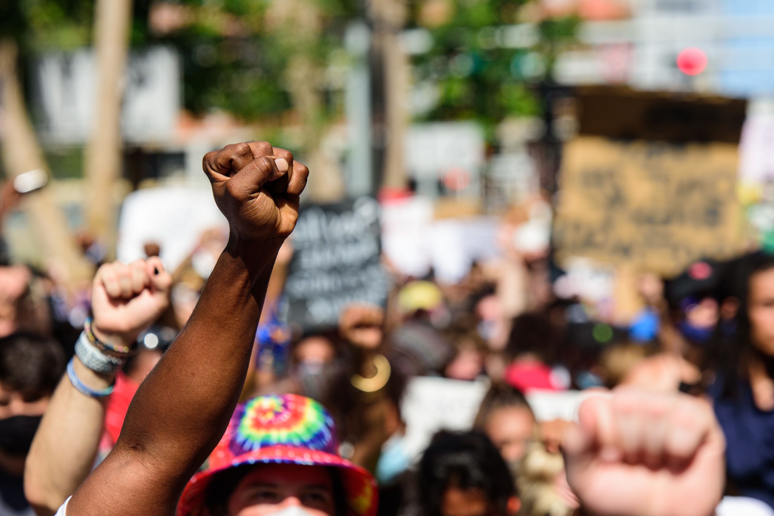 Hands in the air protesting for justice.