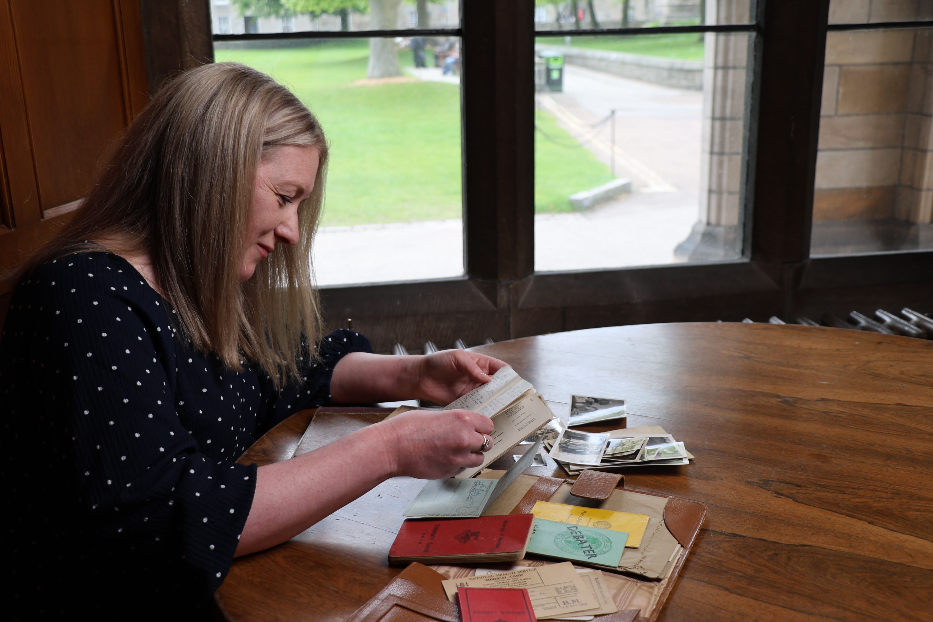 Ruth Mellis looking at her grandmother's diaries