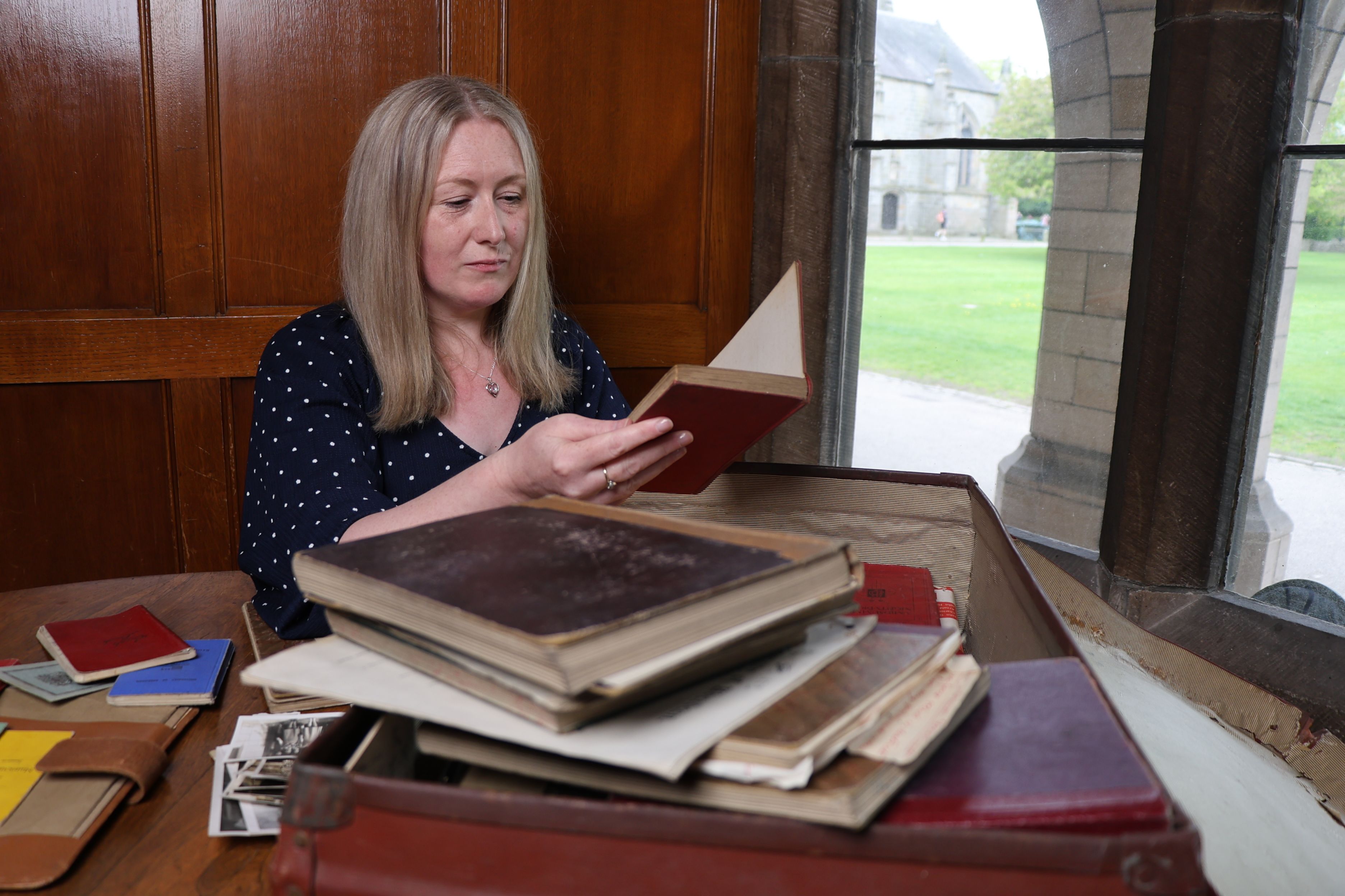 Ruth Mellis with her grandmother's diaries and documents